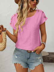 Pink eyelet knit t-shirt with shoulder buttons and short sleeves.