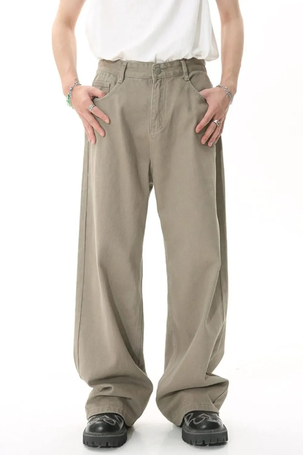 Khaki wide-leg denim pants with a relaxed fit and front pockets.