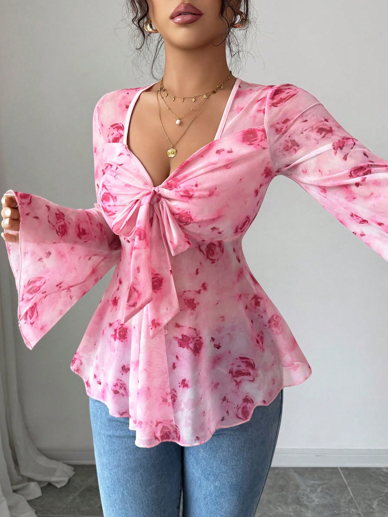 Pink floral chiffon blouse with tie-front and bell sleeves
