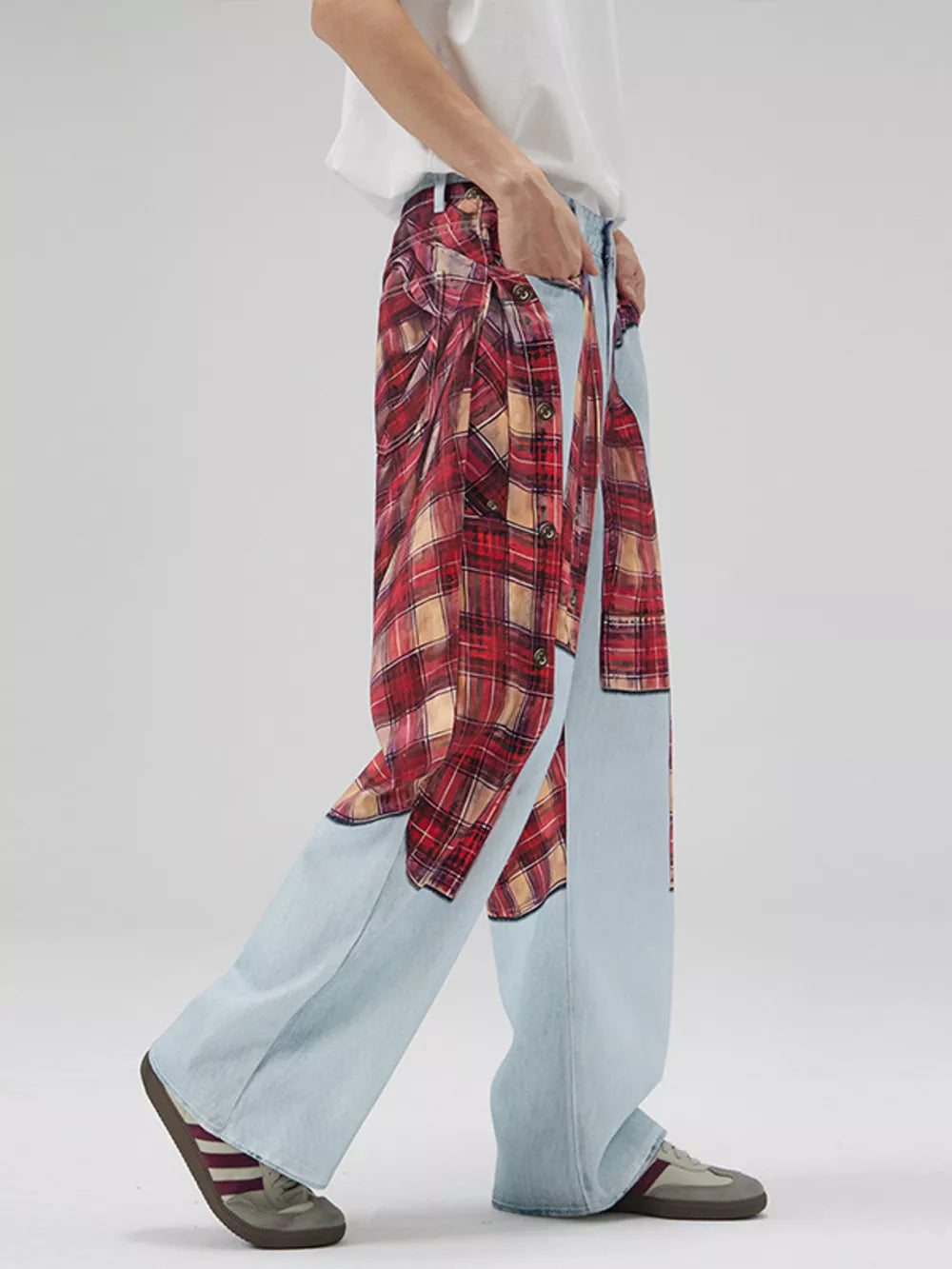 Men's light wash wide-leg jeans with red plaid patchwork details.