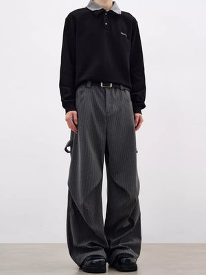 Men's grey pinstripe wide-leg sweatpants with pockets and belt loops.