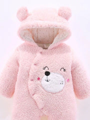 Blush pink hooded one-piece baby romper with bear ears and embroidered bear face detail.