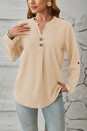 Ivory V-neck button-down blouse with cuffed sleeves and a relaxed fit.