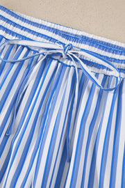 Maternity pants with blue and white vertical stripes, elastic waistband, and drawstring tie.