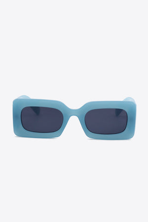 Teal acetate rectangle sunglasses with dark lenses.