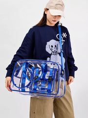 Chic clear PVC travel bag with blue accents and adjustable strap.