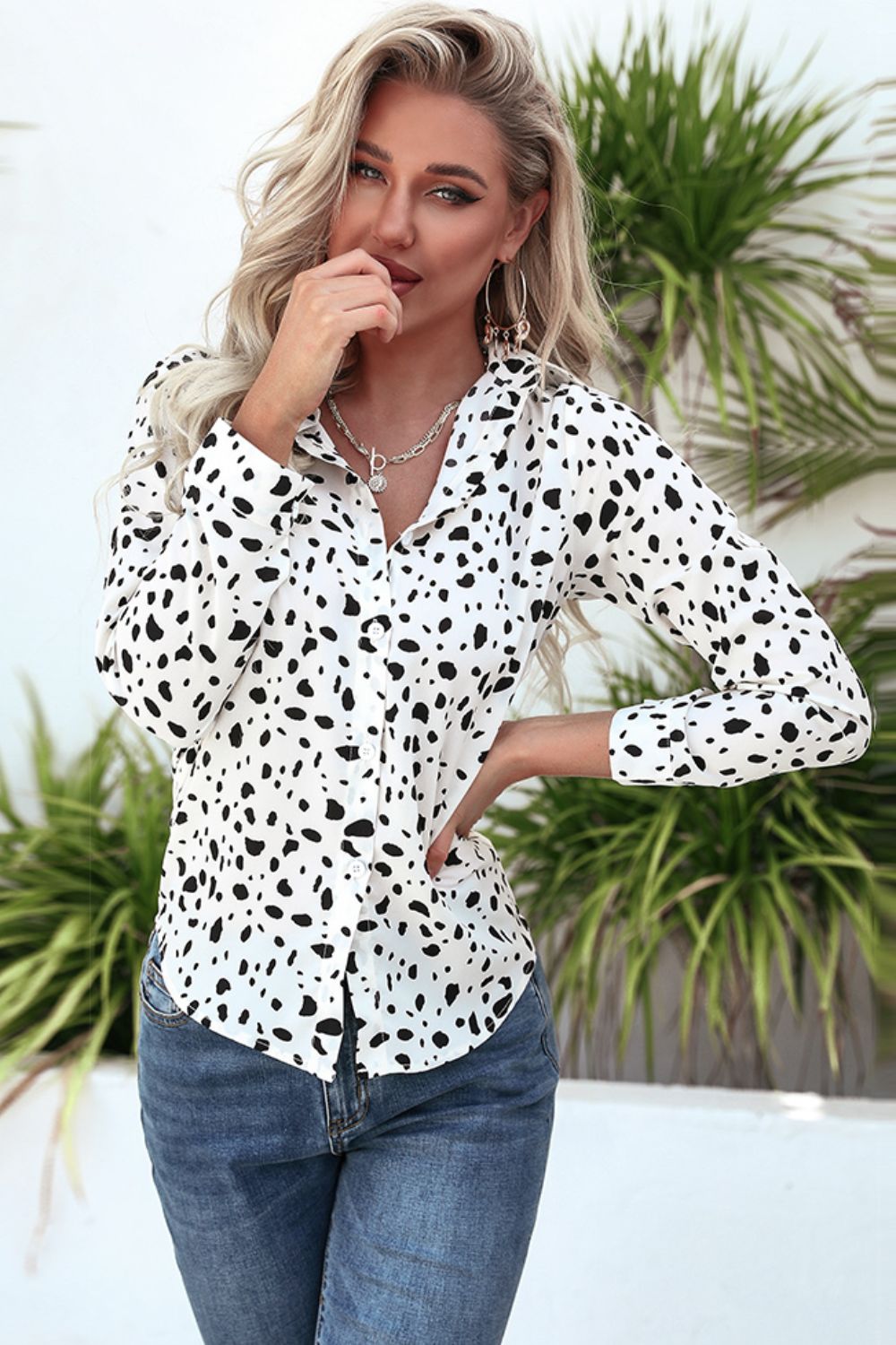Dalmatian print button-up shirt in white with a knot-front detail.