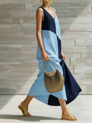 Geometric V-neck maxi dress in light blue and navy with colorblock pattern.