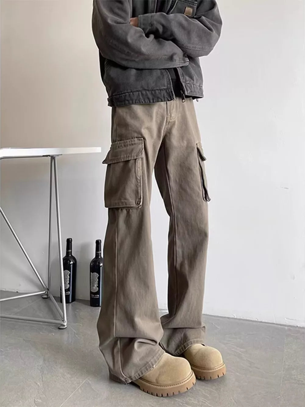 Brown cargo pants with multiple pockets and a relaxed fit.