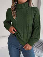 Dark green cable knit turtleneck sweater with voluminous sleeves and ribbed cuffs.
