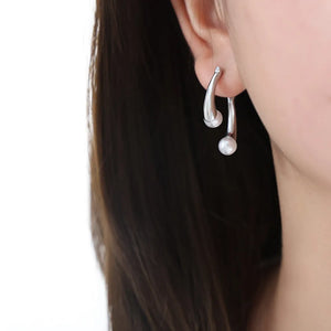Silver sculptural drop hoop earrings with pearl detail