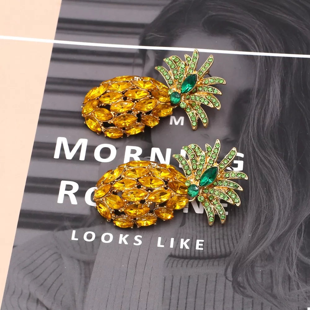 Pineapple dangle earrings with yellow and green rhinestones.