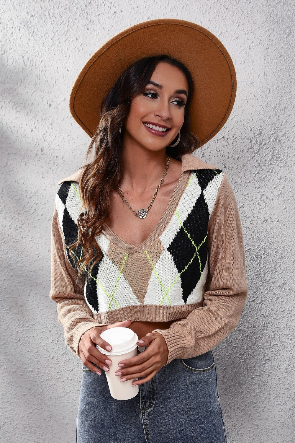 Argyle collar crop knit sweater in taupe with black, white, and neon green diamond pattern.
