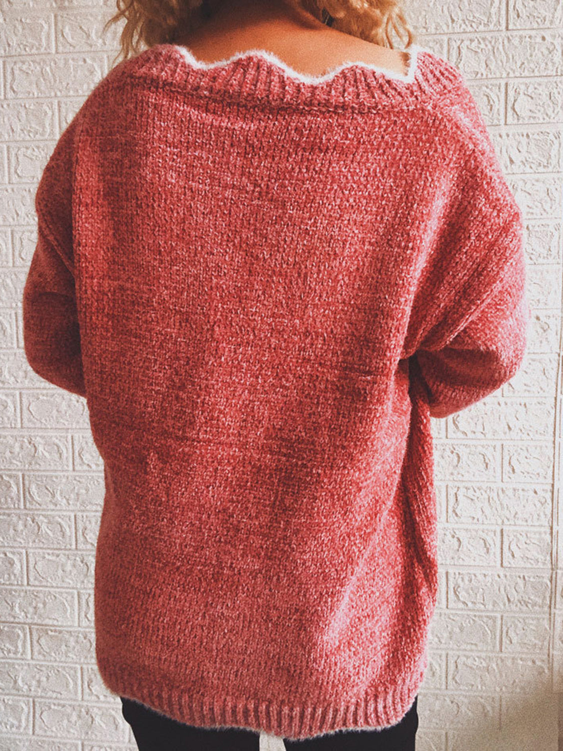 Red orange acrylic knit sweater with scalloped V-neck detail