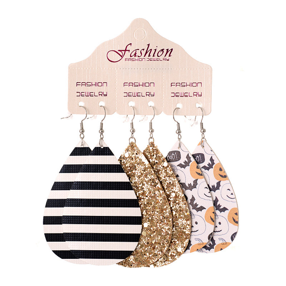 Spooky print teardrop earrings set with black stripes, gold glitter, and Halloween pumpkins.