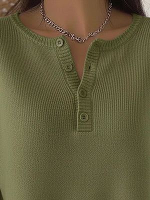 Army green long-sleeve knit top with button detail at the neckline.