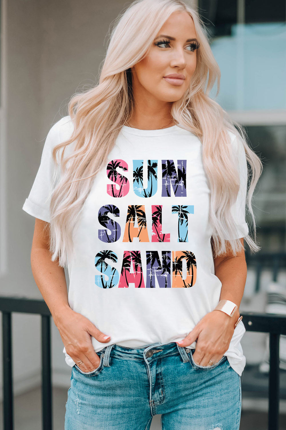 White t-shirt with Sun Salt Sand typography and palm tree graphic print