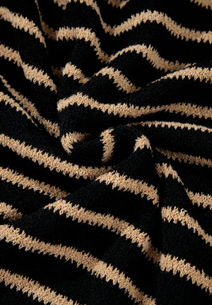 Black and tan horizontal stripe slouchy knit jumper with a textured stitch.