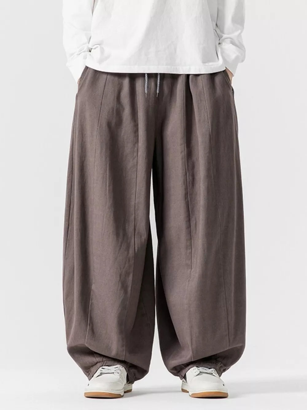 Relaxed fit drawstring sweatpants in Dark Gray with a baggy, casual cut.