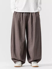 Relaxed fit drawstring sweatpants in Dark Gray with a baggy, casual cut.
