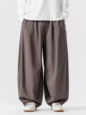 Relaxed fit drawstring sweatpants in Dark Gray with a baggy, casual cut.