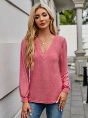 Plunge neckline gathered sleeve top in strawberry pink, with a textured neckline detail.