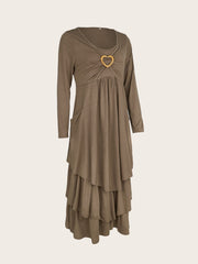 Coffee tiered midi dress with long sleeves and heart detail at neckline.