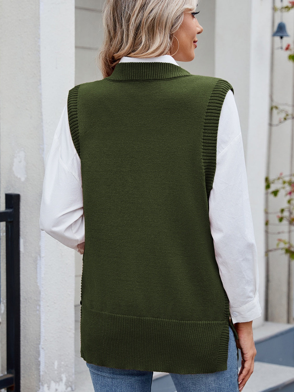 Army green ribbed knit vest with side buttons, collared neckline, and a relaxed fit.