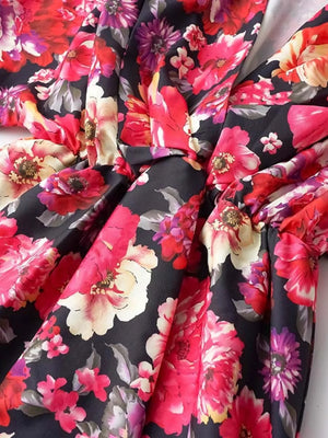Black floral ruffle hem mini dress with a tie detail
