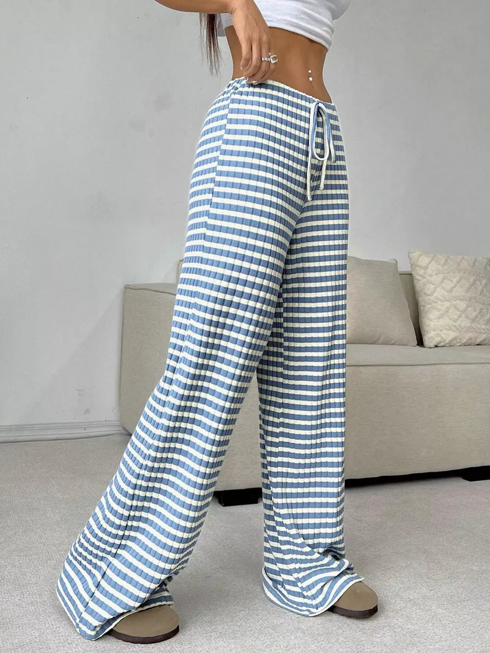 Light blue and white striped ribbed wide-leg pants with drawstring waist.