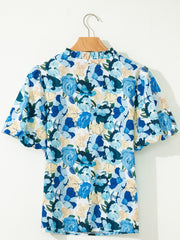 Vibrant floral print cotton blouse with puff sleeves and mock neck