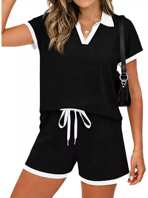 Black polo collar two-piece set with white trim, drawstring shorts with pockets.