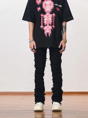 Men's black cotton jeans with frayed hem detail and stacked leg style.