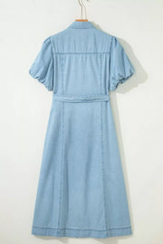 Light blue denim midi dress with puff sleeves, collar, and belted waist.