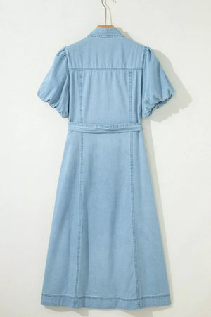 Light blue denim midi dress with puff sleeves, collar, and belted waist.