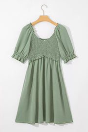 Sage V-neck smocked mini dress with frilled puff sleeves and hem