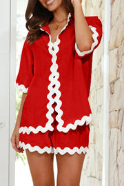 Deep red linen pajama set with white scalloped trim on shirt and shorts