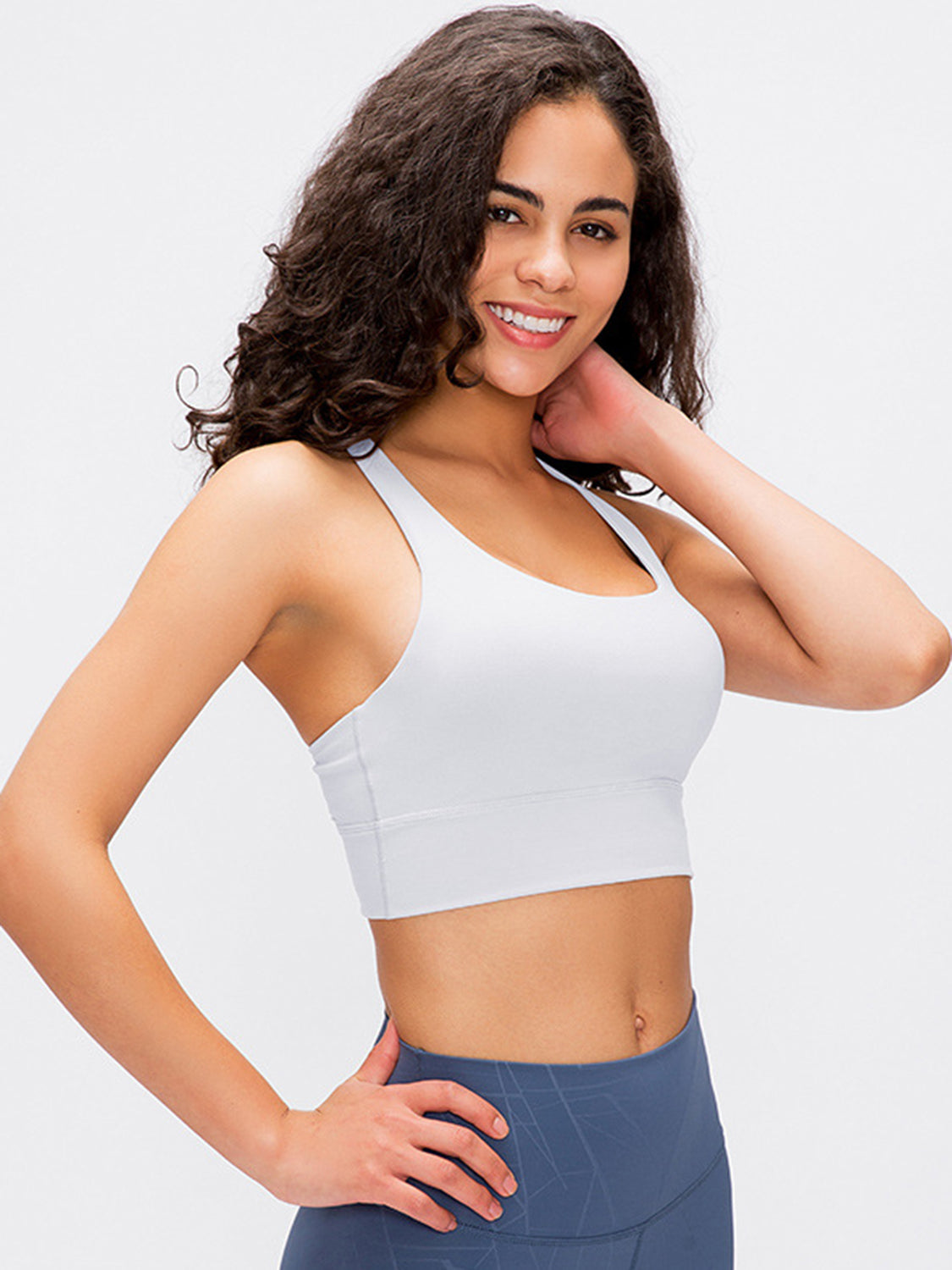 White performance bra with crisscross back detail and wide band