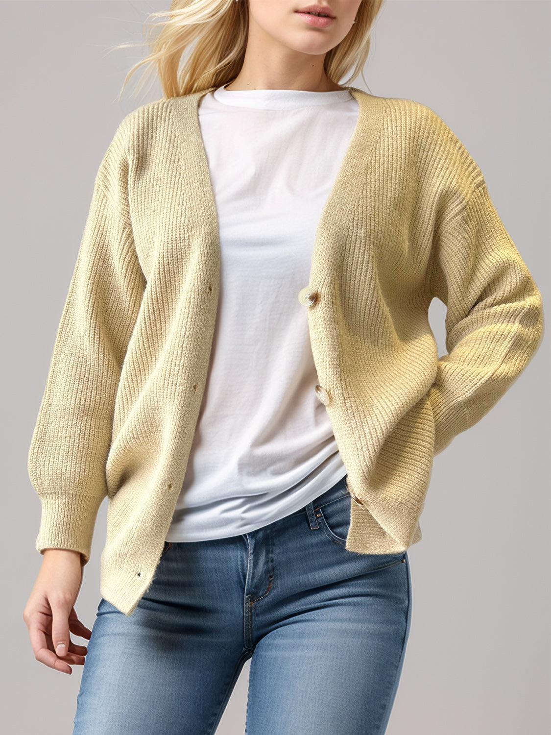 Pastel yellow ribbed knit cardigan with balloon sleeves and button front.
