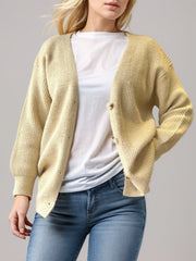 Pastel yellow ribbed knit cardigan with balloon sleeves and button front.