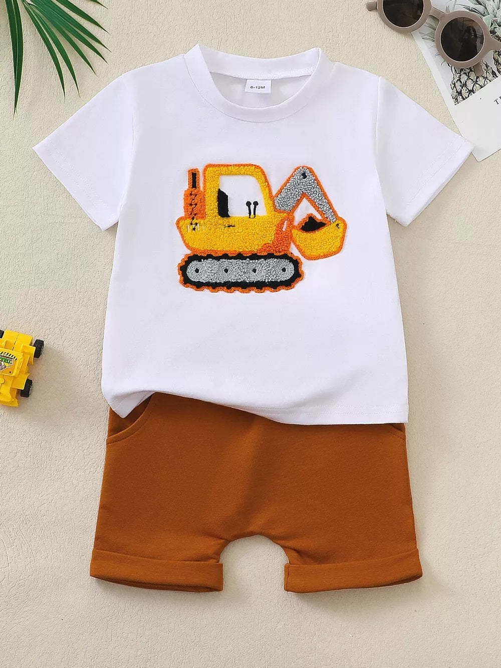 White t-shirt with embroidered excavator graphic and brown shorts baby set