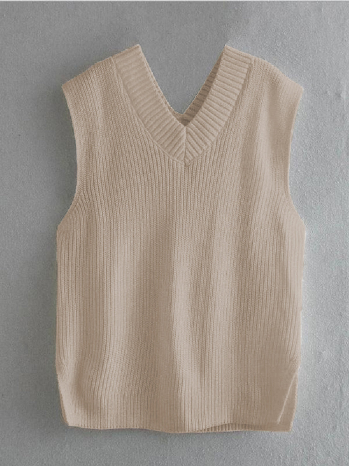 Cream textured knit v-neck sleeveless vest with asymmetric hem