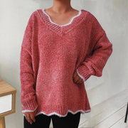 Coral luxe knit sweater with scalloped trim and V-neck.