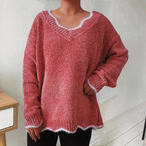 Coral luxe knit sweater with scalloped trim and V-neck.