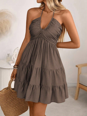 Brown ruched halter tiered mini dress with ruffles, above knee length
