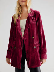 Burgundy velvet double-breasted blazer with patch pockets and button closure.
