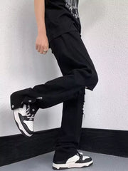 Black distressed loose-fit jeans with snap detail and adjustable hem