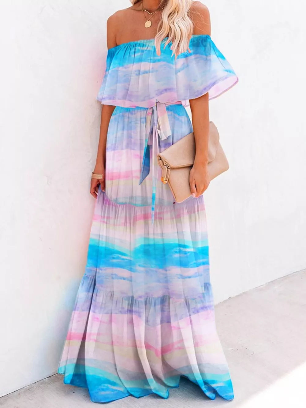 Off-shoulder tiered maxi dress with watercolor sky print and tie waist.