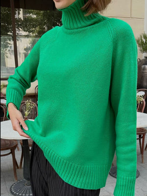 Mid Green cashmere turtleneck sweater with raglan sleeves and ribbed cuffs and hem.