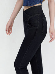 Crossover waist flare jeans in black denim with a high rise and bootcut leg.